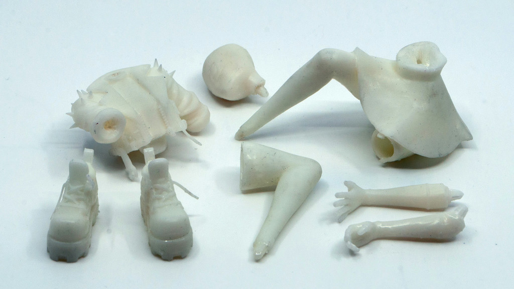 A photograph of the un-primed 3D-printed resin body parts straight out of the 3D printer.